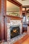 Clouse up view of antique fireplace with decorative tile trim.