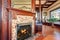 Clouse up view of antique fireplace with decorative tile trim.