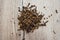 Clove spices on a wooden background. View from above.