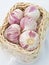 Cloves of garlic in a basket.