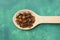 Cloves on wooden spoon