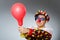 Clown with balloons in funny concept