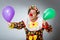 Clown with balloons in funny concept