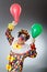 Clown with balloons in funny concept