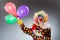 The clown with balloons in funny concept