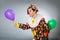 The clown with balloons in funny concept