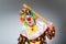 Clown with baseball bat in funny concept
