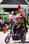 Clown on Bicycle Waves to Crowd at Mendota Parade