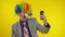 Clown businessman entrepreneur boss in wig making selfies using smartphone