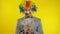 Clown businessman entrepreneur boss in wig with money banknotes. Halloween