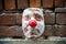 A clown face on the street of Carrara Carrara