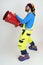 The clown firefighter holds a fire barrel in his hands, extinguishes the fire