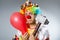 The clown with a hammer grey background isolated