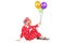 Clown holding balloons seated on the floor
