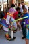 Clown Inflates Balloon For Kid At Festival