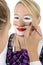 Clown make-up for carnival, costume party, circus or fair with multiple colors