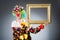 Clown with picture frame in funny concept