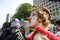 Clown protester blowing bubbles.