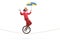 Clown riding a unicycle on a rope and holding an umbrella