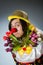 The clown with tulip flowers in funny concept