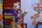 Clown in violet costume doing children`s magic
