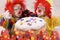 Clowns with red hairs and sweet donut