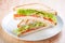 Club sandwich with salmon, cheese, lettuce