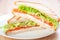 Club sandwich with salmon, cheese, lettuce