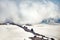 Clubs of fog and clouds move along slope of Mount Elbrus