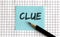 CLUE , the phrase is written on colored stickers, on a notepad background. Business concept