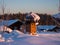 Clump of snow on a stylish forged pipe. Dawn at the Siberian Ski Resort Gornaya Salanga