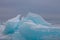 Clumps of blue ice hummocks lake at dusk