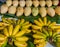 Cluster Banana and mango fruit on sales in the market