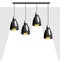 Cluster of four pendant lamps, ceiling lamps or hanging lamps with a ray of white light. Decor and interior element for home or