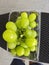 cluster of fresh greenish gold muscat grape.