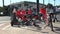 A cluster of rental bikes and e-scooters on a street corner in Santa Monica