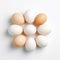 Cluster Of White And Brown Eggs On A White Background