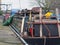 Cluttered houseboat on a converted barge in huddersfield west yorkshire