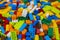 Cluttered pile of colorful toy construction bricks