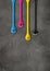 Cmyk ink drops on dark concrete background