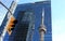 CN Tower reflected in Marsh & McLennan skyscraper in Toronto.