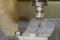 The CNC milling machine cutting press die part by solid bull end mill tool and G-code data background