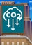 CO2 emission sign, Carbon dioxide icon on a billboard atop a building.