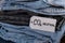 CO2 neutral emission text note on stack of jeans. Ecology nature friendly, climate change, green fuel and earth protect