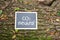 \'CO2 neutral\' written on a board on a tree trunk - carbon neutrality concept