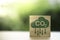 CO2 reducing icon assemble on wooden cube block for decrease CO2 , carbon footprint and carbon credit to limit global warming from