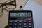 Co2 Steuer write on the calculator on Office Desk. German language it means co2 tax