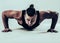 Coach bodybuilding performs push-UPS.photo on a white background