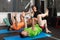 A coach guiding two of his trainees at the gym