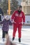 Coach at the ice rink teaches kids to skate